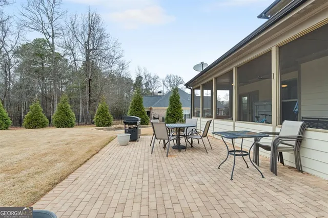 a bathroom with a tub and window