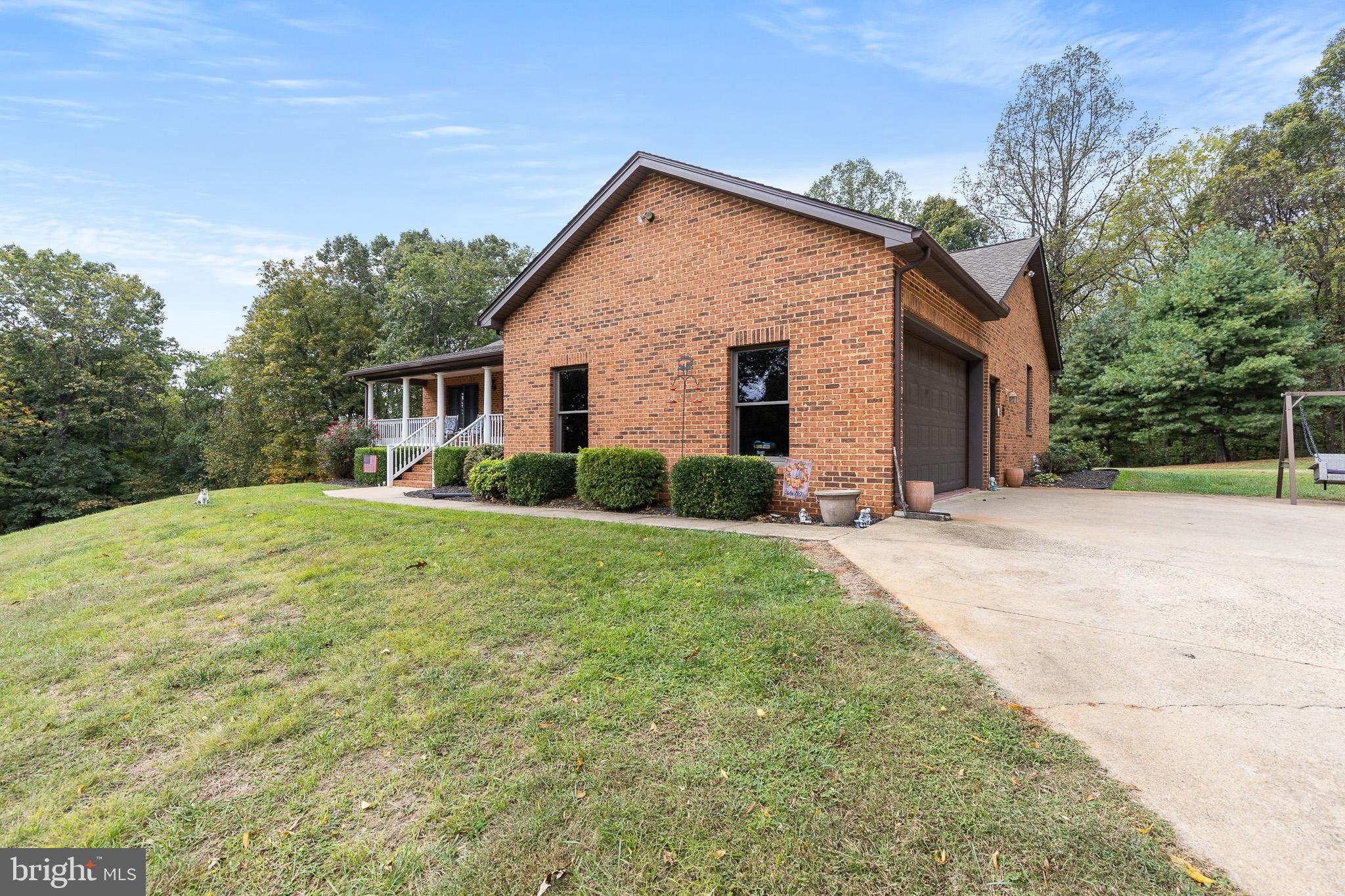 21246 Clarks Mountain Road Rapidan, VA 22733 - Photo 3 of 38 a front view of house with yard and green space