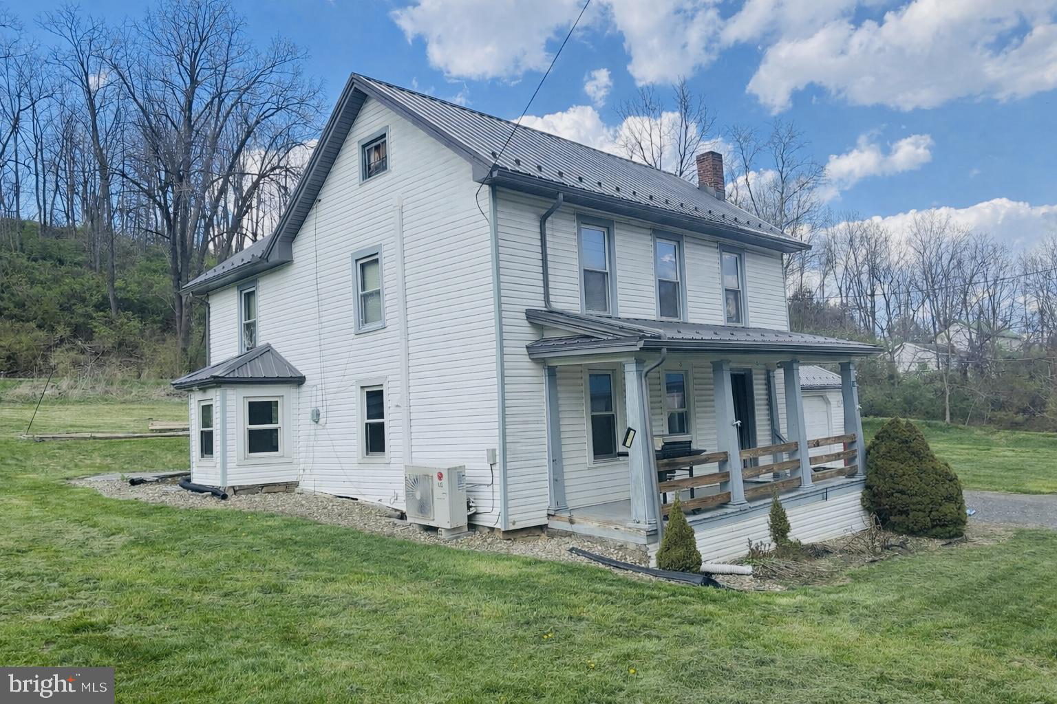 153 Buffalo Run Road Bellefonte, PA 16823 - Photo 1 of 7 Charming white farmhouse on lush grounds.