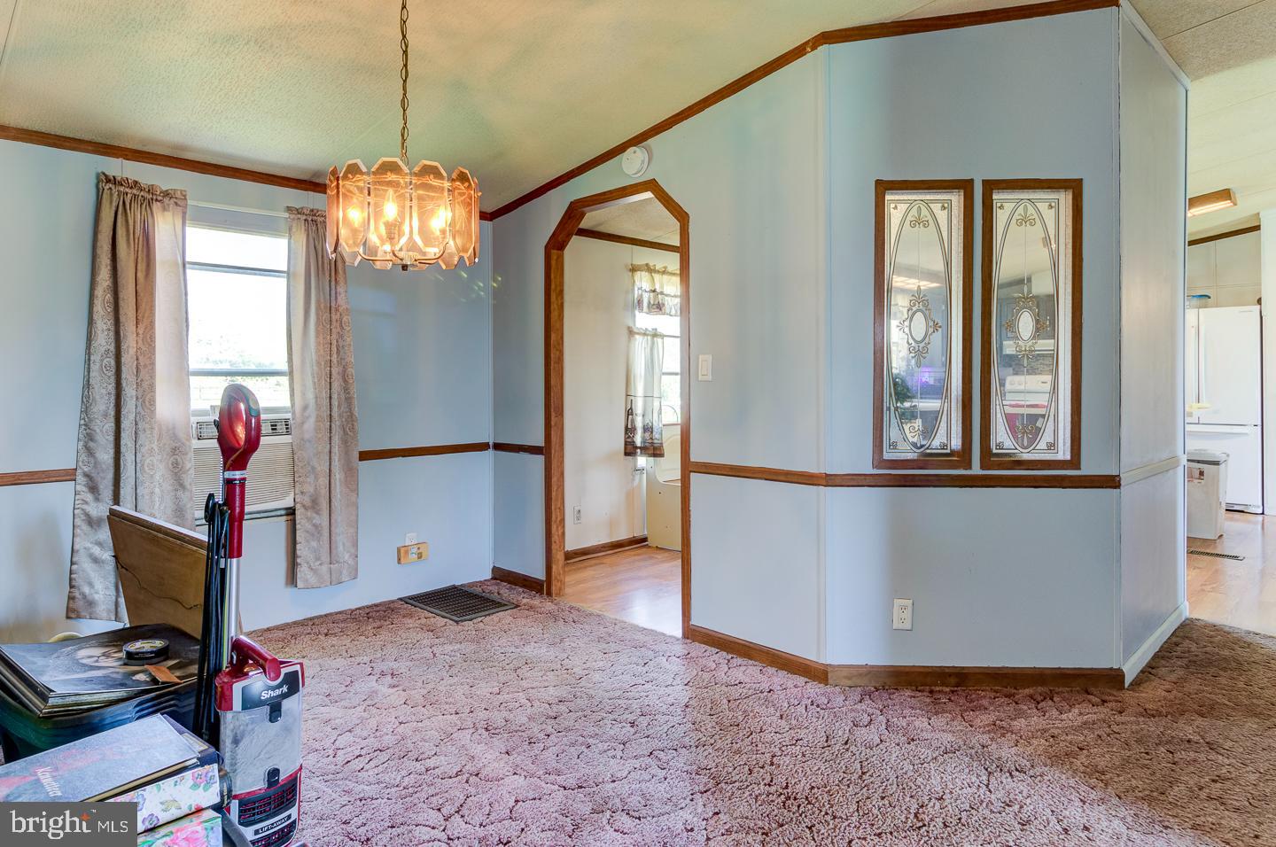 936 Newark Road Avondale, PA 19311 - Photo 12 of 38 a view of a livingroom with a furniture chandelier and a chandelier