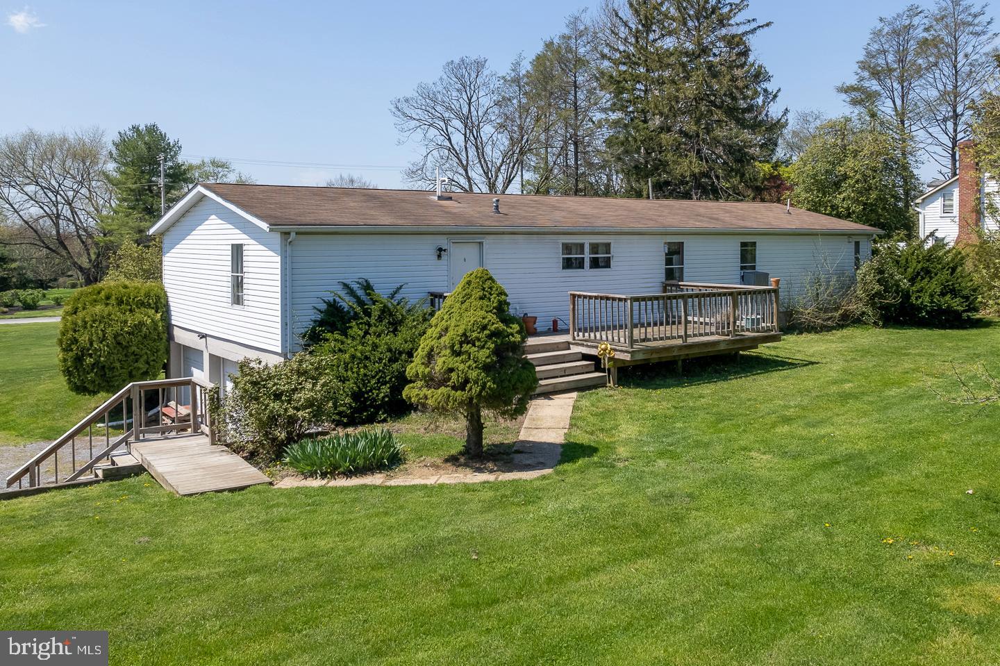 936 Newark Road Avondale, PA 19311 - Photo 22 of 38 a view of a house with a yard and a patio