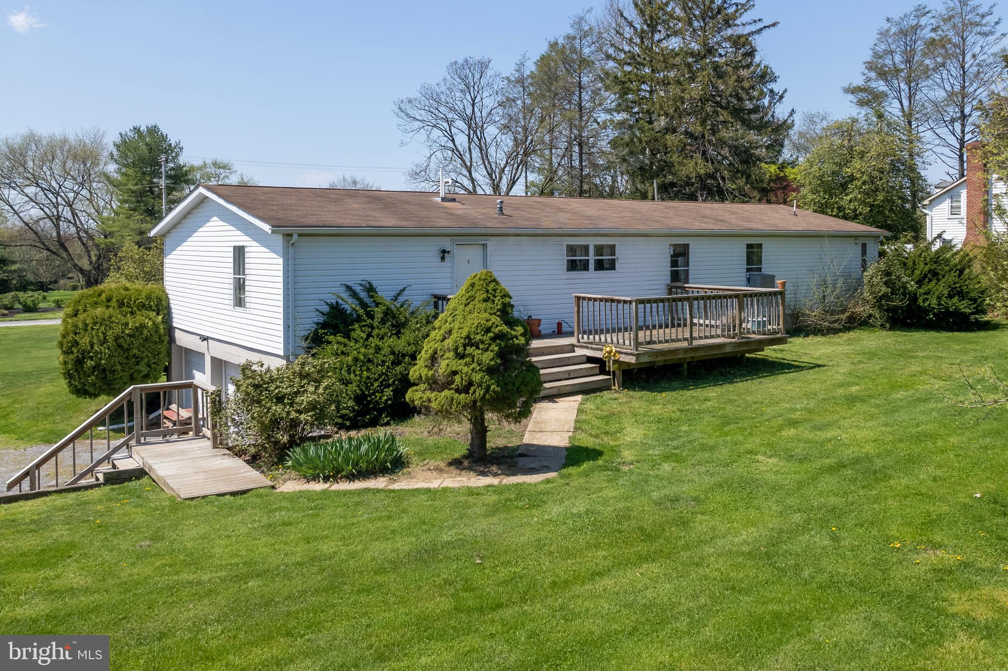 936 Newark Road Avondale, PA 19311 - Photo 30 of 38 a view of a house with a yard and a patio