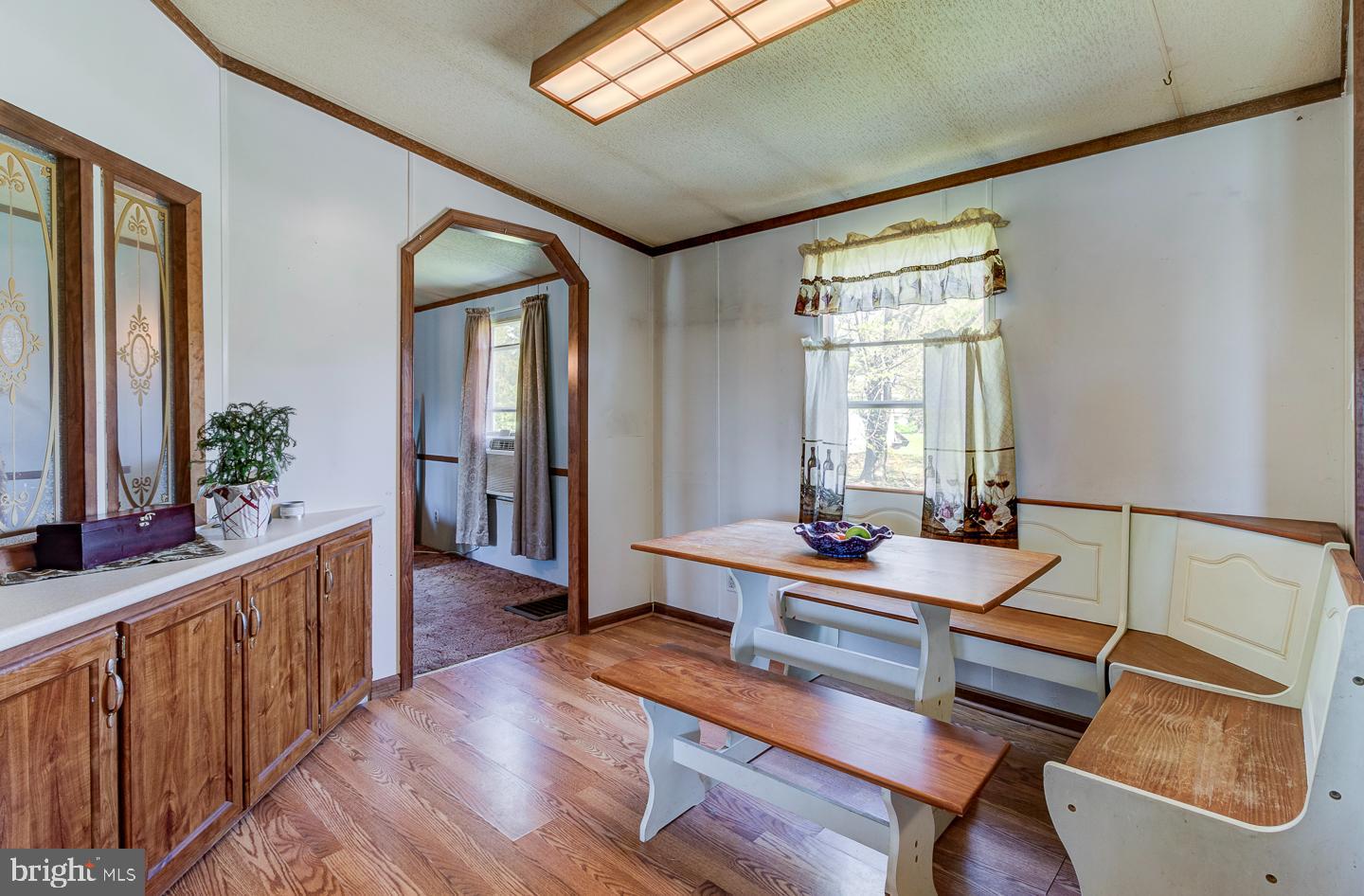 936 Newark Road Avondale, PA 19311 - Photo 6 of 38 a dining room with wooden floor and furniture