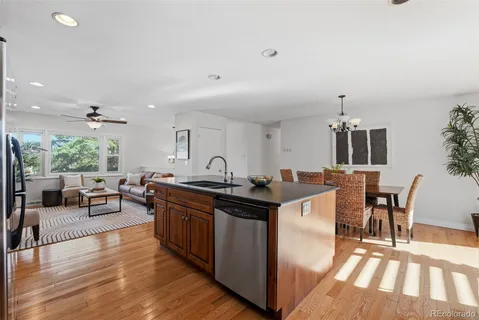 a kitchen with stainless steel appliances granite countertop a stove refrigerator sink and cabinets