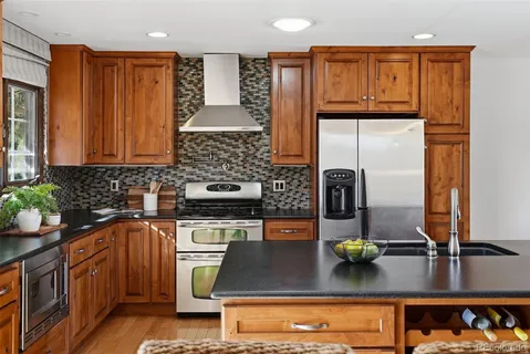 a bedroom with a large bed and ceiling fan
