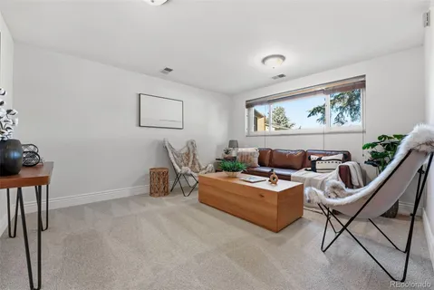 a view of a roof deck with wooden floor and bench
