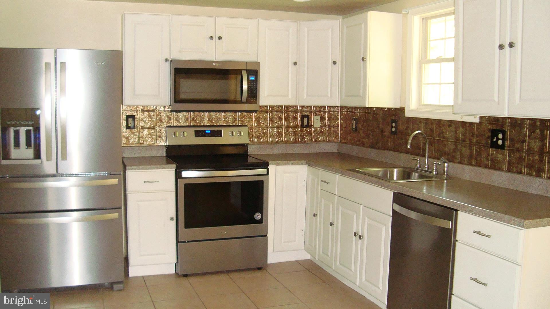 545 Trimble Road Joppa, MD 21085 - Photo 4 of 23 Kitchen.~ Beautiful appliances and backsplash.