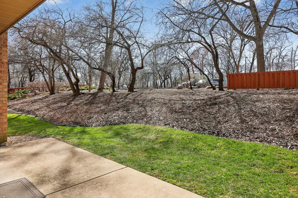 a view of backyard with large trees