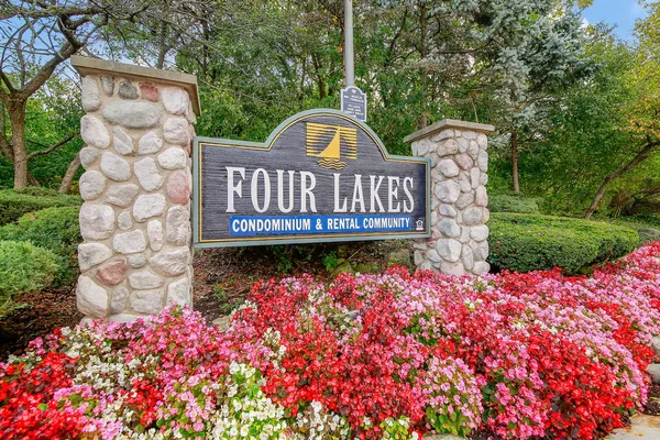a view of a chair and table in the garden