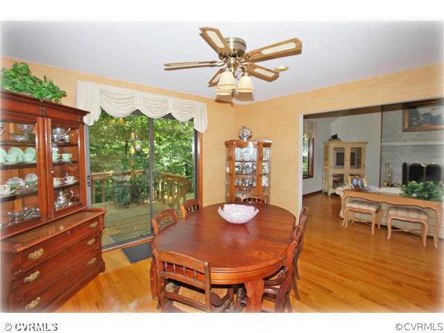 3181 East Brigstock Road Midlothian, VA 23113 - Photo 4 of 16 a view of a dining room with furniture window and wooden floor