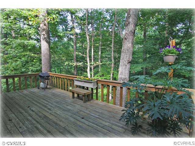 3181 East Brigstock Road Midlothian, VA 23113 - Photo 6 of 16 a view of a deck with chairs and wooden floor