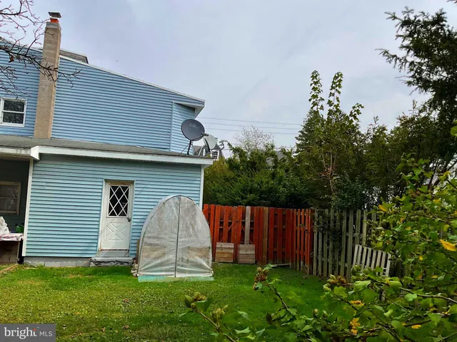 a kitchen with granite countertop a sink and cabinets