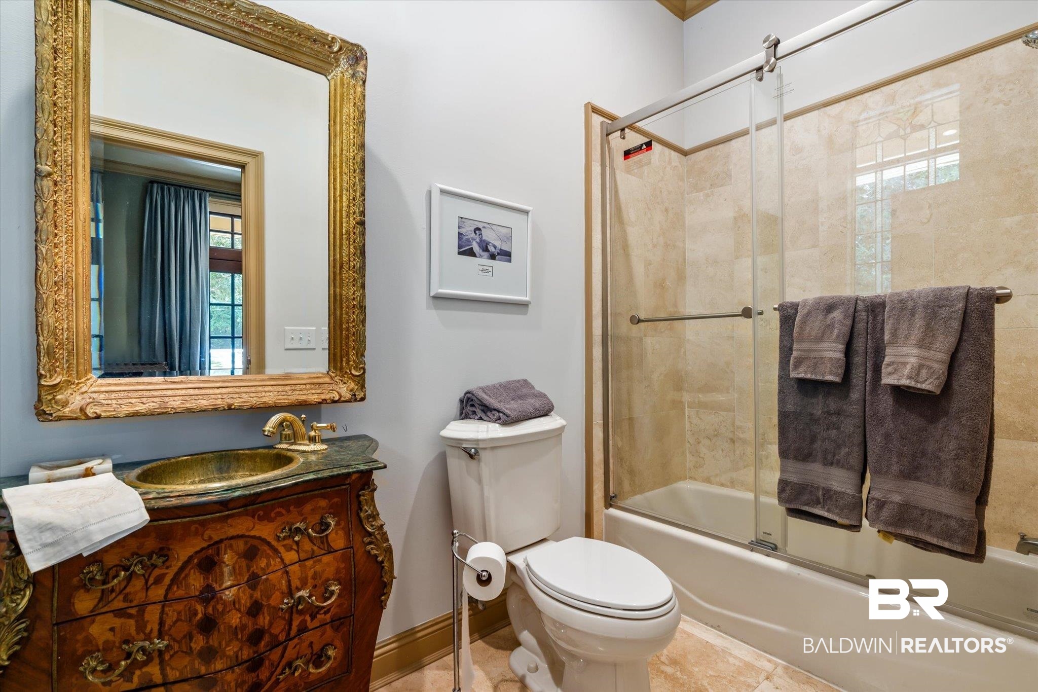 6341 Raintree Road Fairhope, AL 36532 - Photo 19 of 40 Full bathroom with shower / bath combination with glass door, tile patterned floors, toilet, and vanity