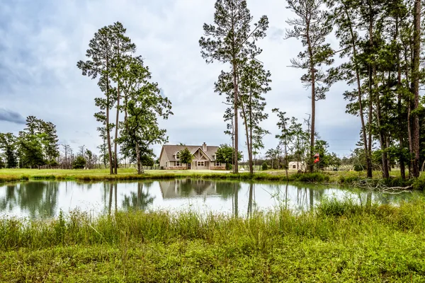 a view of a lake with houses in the back