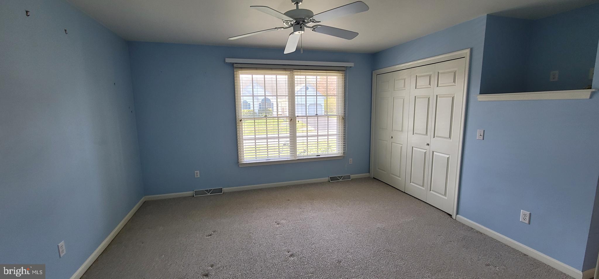 16891 Essex Road Lewes, DE 19958 - Photo 13 of 18 an empty room with windows and fan