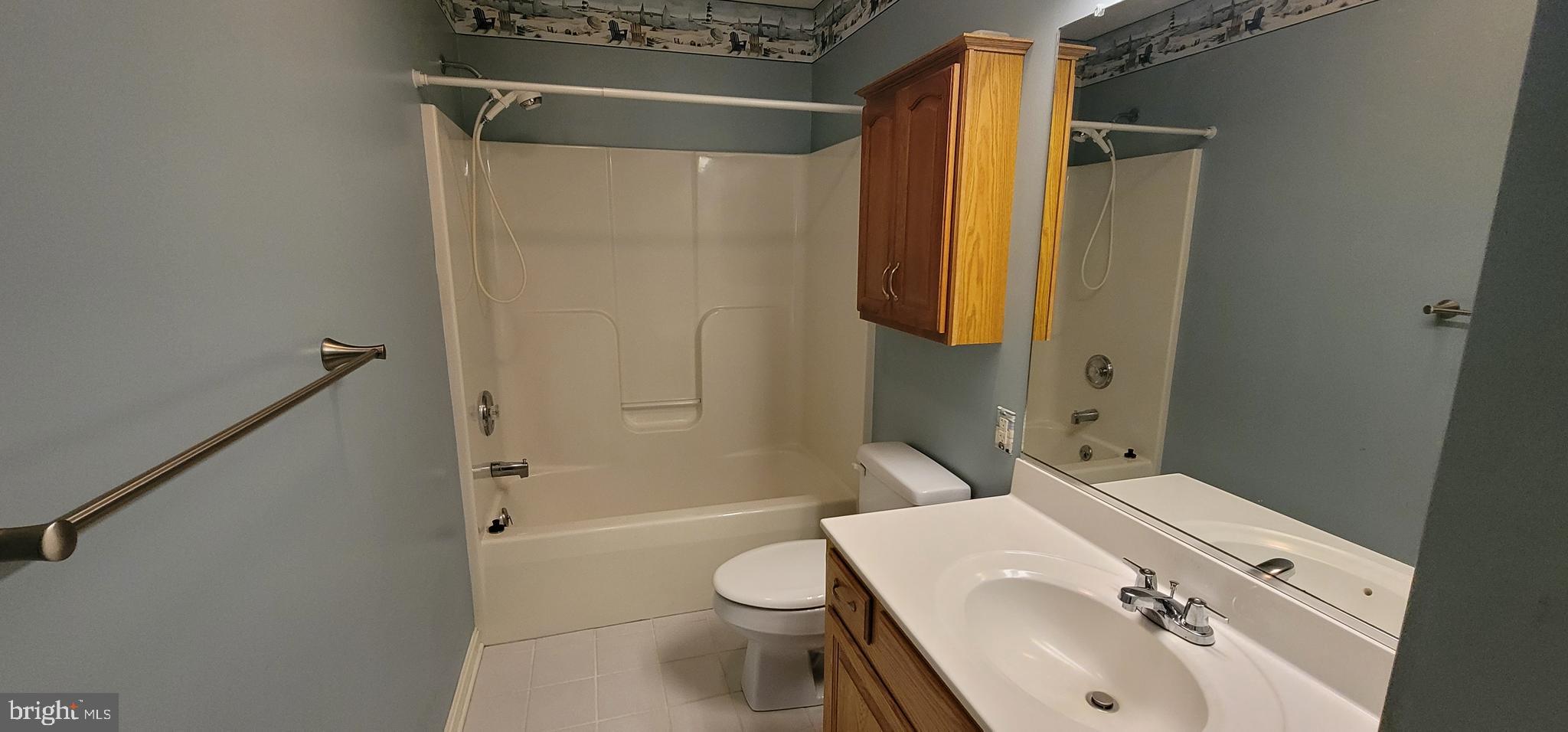 16891 Essex Road Lewes, DE 19958 - Photo 18 of 18 a bathroom with a sink toilet and shower
