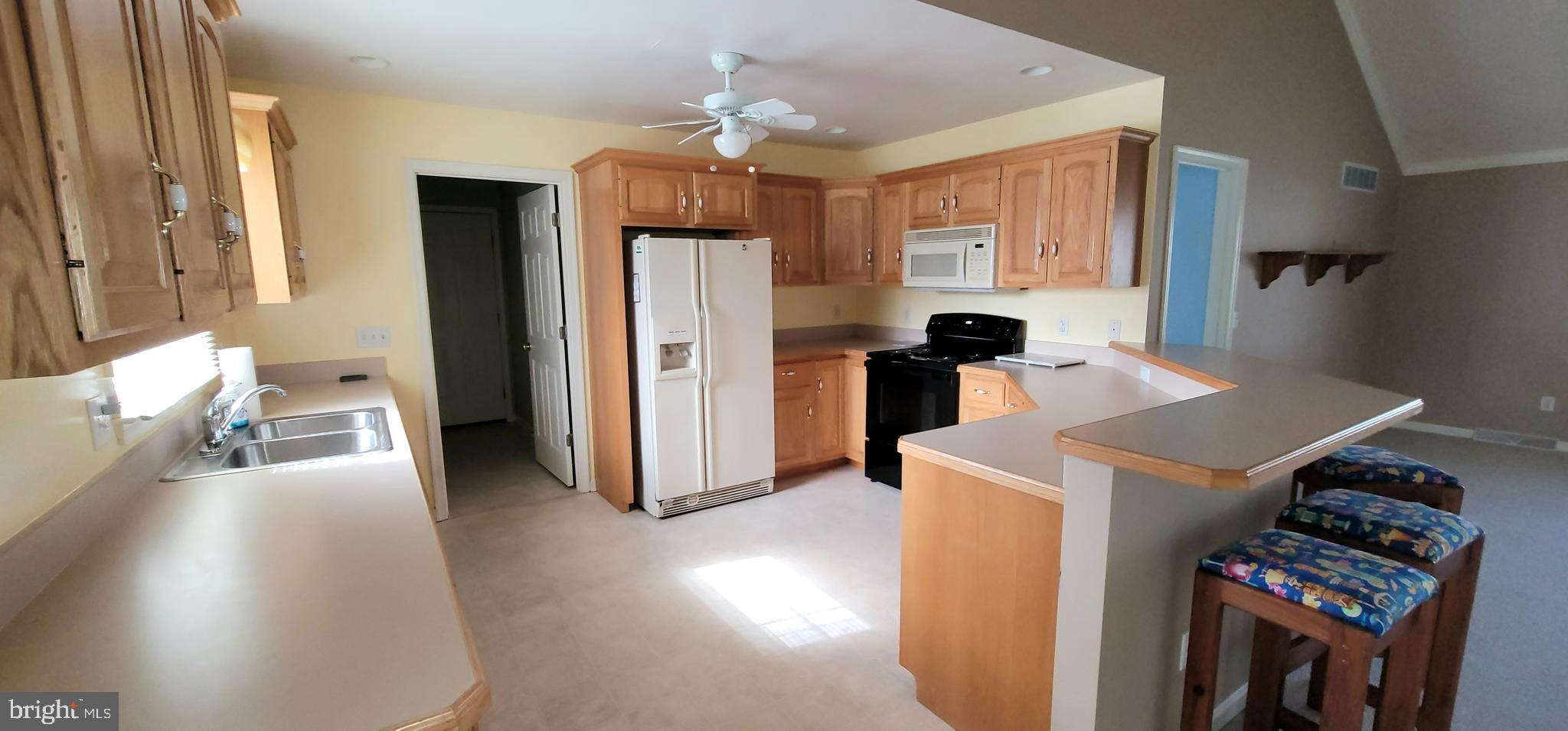 16891 Essex Road Lewes, DE 19958 - Photo 5 of 18 a view of kitchen and living room