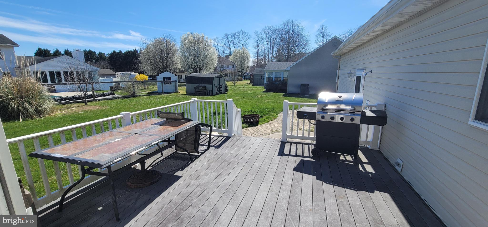 16891 Essex Road Lewes, DE 19958 - Photo 8 of 18 a view of a patio with couches table and chairs and potted plants