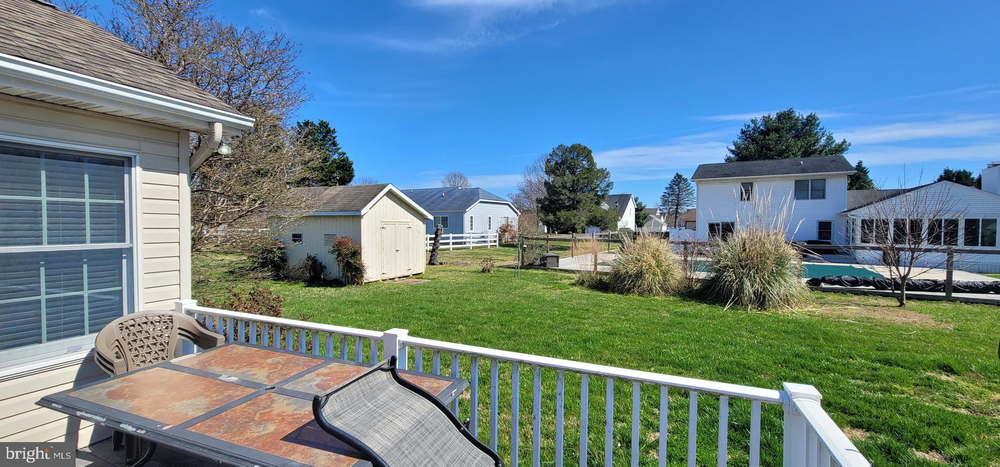 16891 Essex Road Lewes, DE 19958 - Photo 9 of 18 a view of a house with backyard and porch