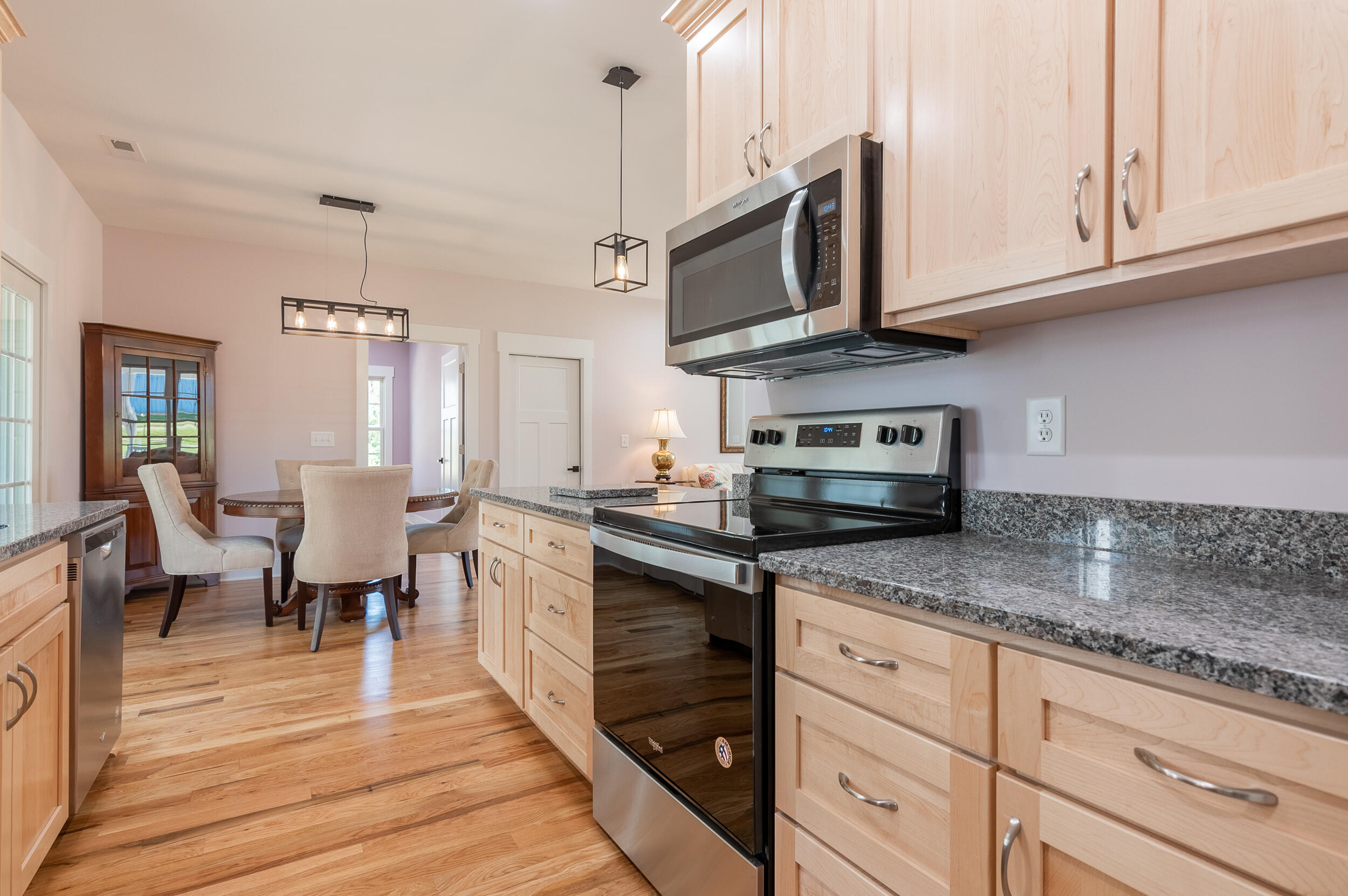 402 Parkview Road Northeast Floyd, VA 24091 - Photo 22 of 48 a kitchen with stainless steel appliances granite countertop a stove a sink dishwasher and a microwave oven with white cabinets