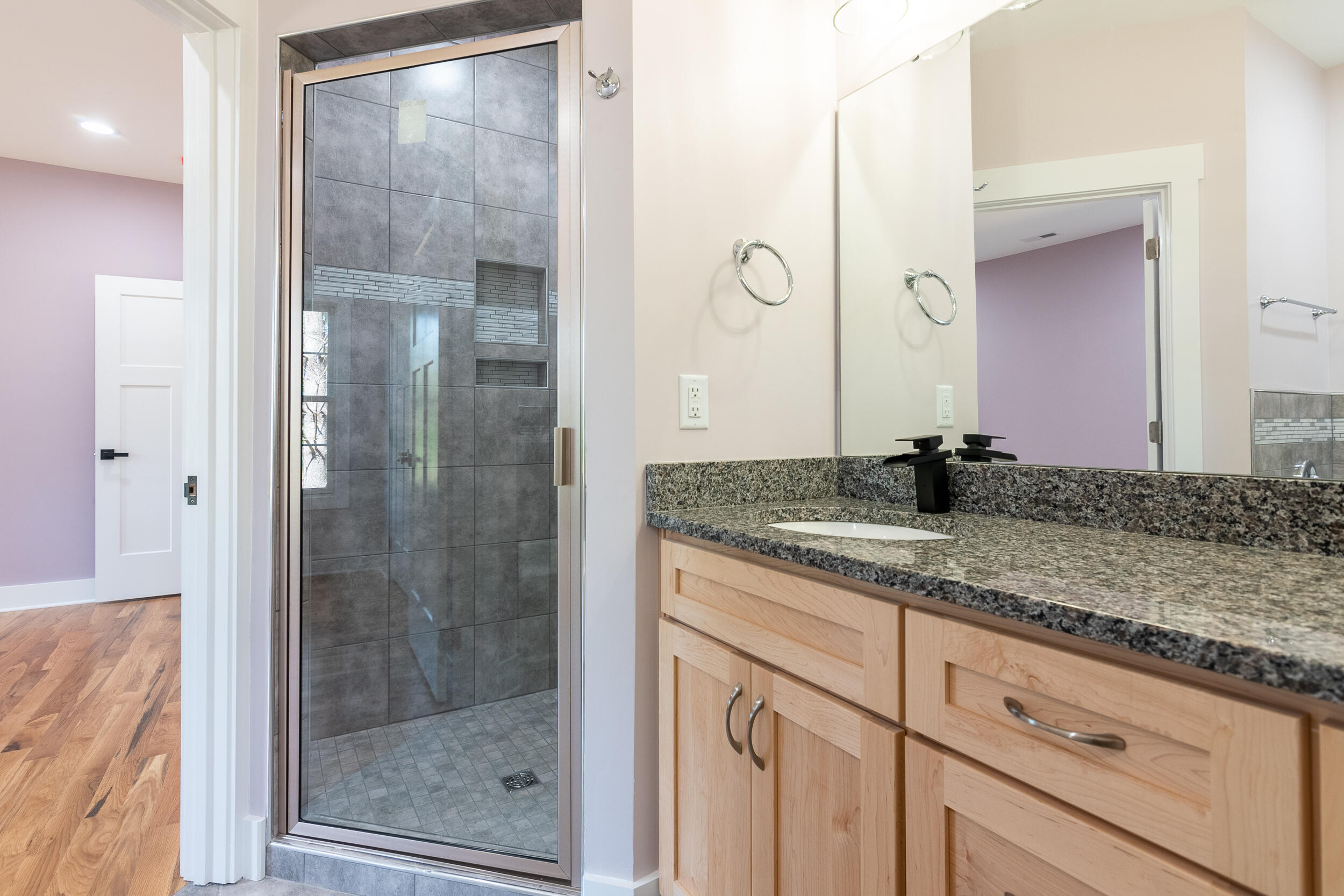 402 Parkview Road Northeast Floyd, VA 24091 - Photo 37 of 48 a bathroom with a granite countertop sink mirror and vanity