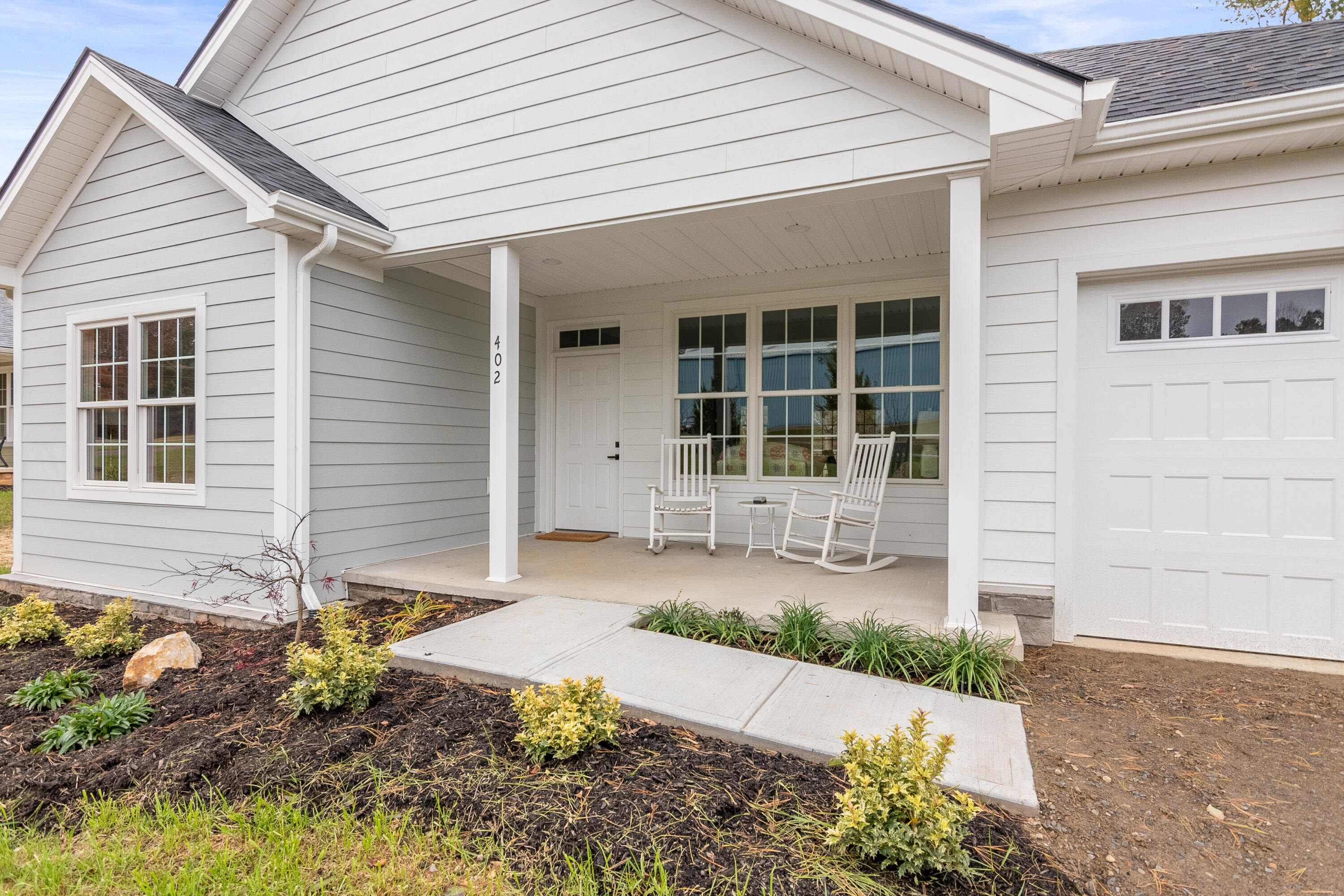402 Parkview Road Northeast Floyd, VA 24091 - Photo 5 of 48 a front view of a house with garden