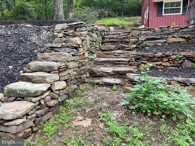 a swimming pool with trees in the background