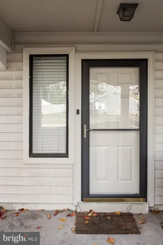 a view of a door and a window