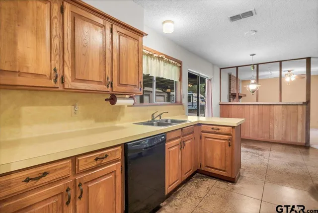a kitchen with stainless steel appliances granite countertop a stove a refrigerator and a microwave