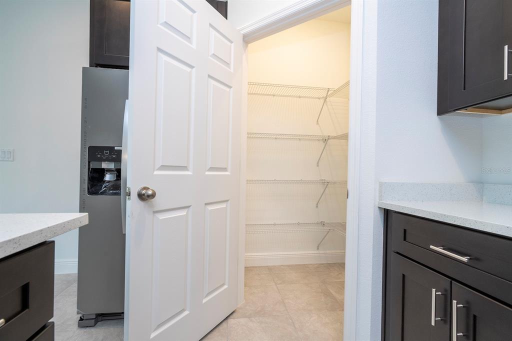 1533 West Diamond Road Citrus Springs, FL 34434 - Photo 16 of 66 a view of storage and utility room with washer and dryer