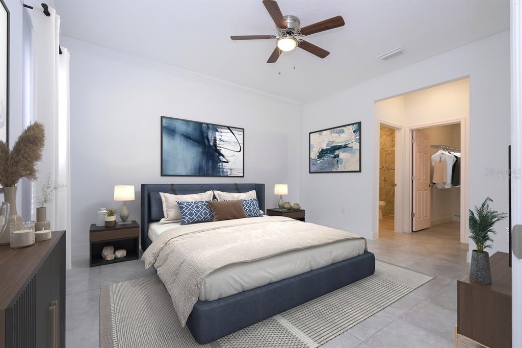 1533 West Diamond Road Citrus Springs, FL 34434 - Photo 24 of 66 a bedroom with a large bed and a chandelier