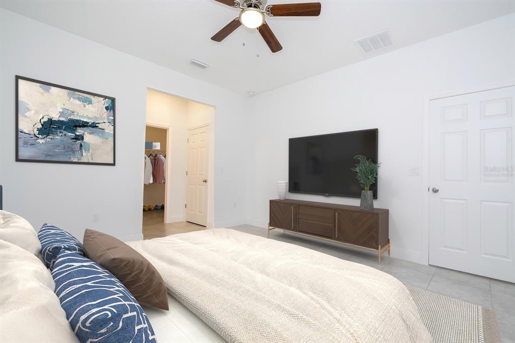 1533 West Diamond Road Citrus Springs, FL 34434 - Photo 26 of 66 a bedroom with a bed and a flat screen tv