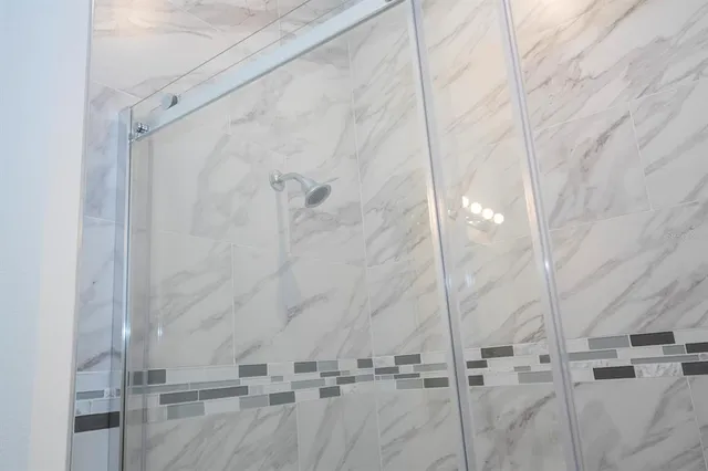 a bathroom with a sink toilet a bathtub and shower