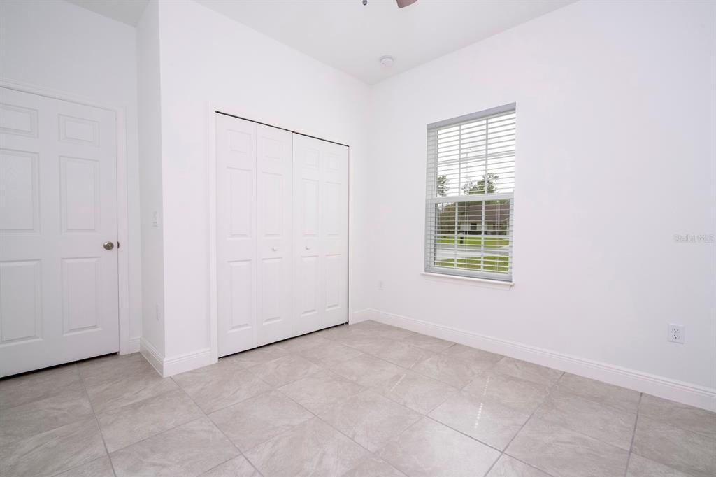 1533 West Diamond Road Citrus Springs, FL 34434 - Photo 43 of 66 an empty room with windows