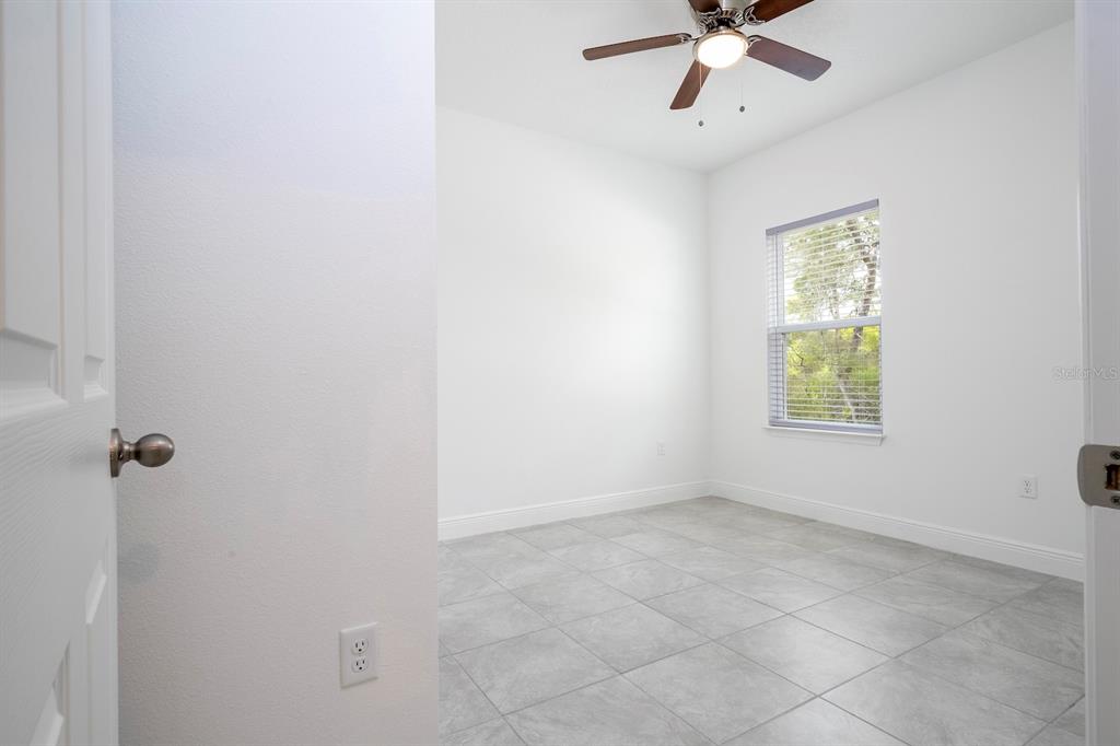 1533 West Diamond Road Citrus Springs, FL 34434 - Photo 50 of 66 a view of an empty room with a window