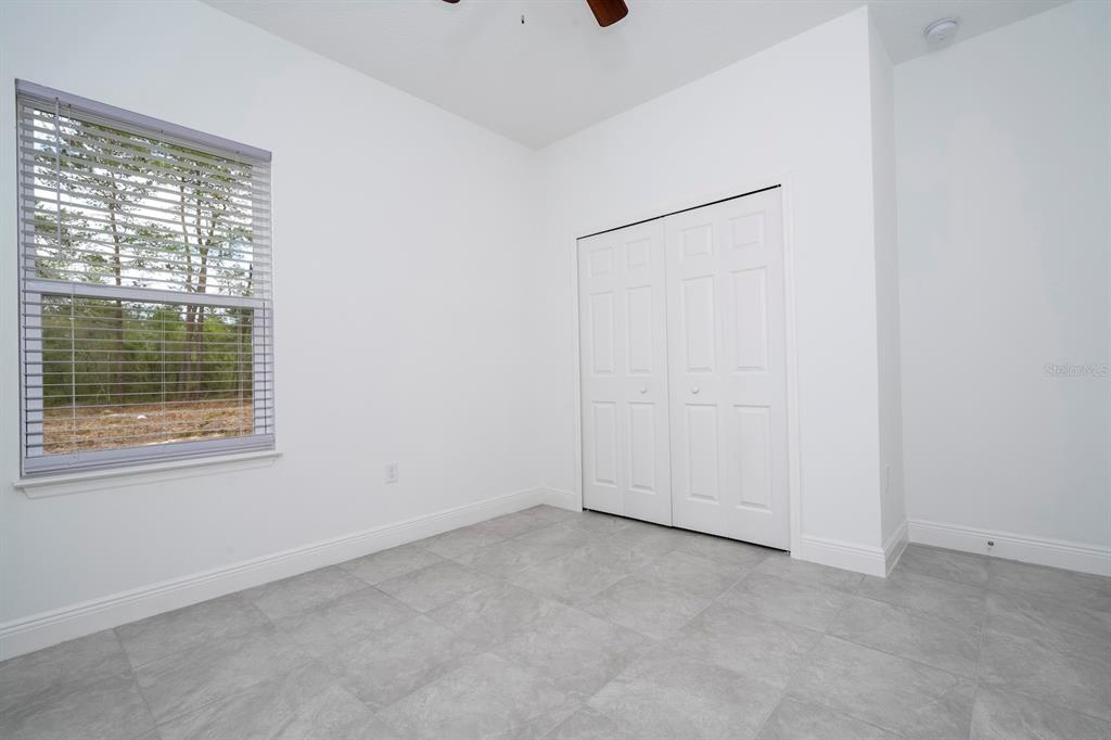 1533 West Diamond Road Citrus Springs, FL 34434 - Photo 55 of 66 an empty room with a window