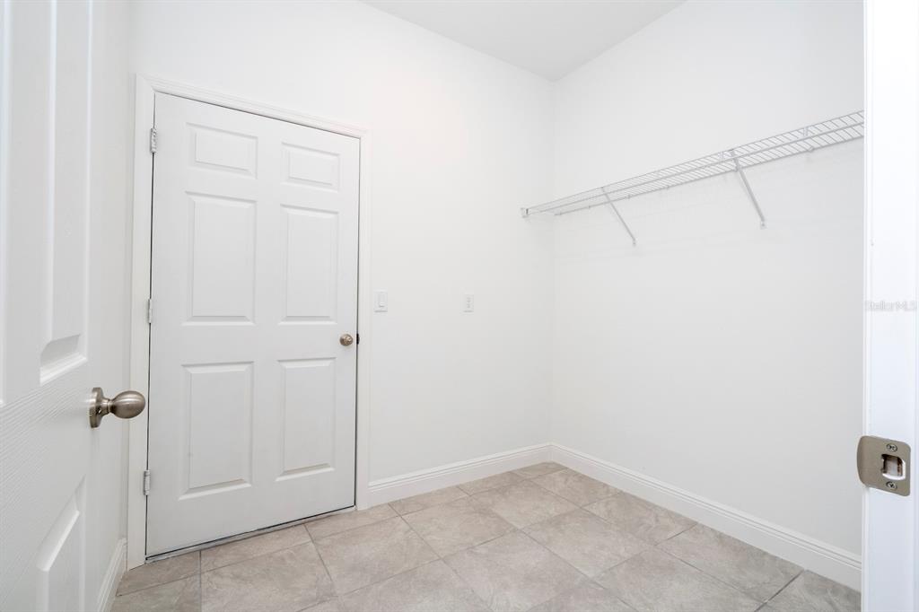 1533 West Diamond Road Citrus Springs, FL 34434 - Photo 58 of 66 an empty room with a door