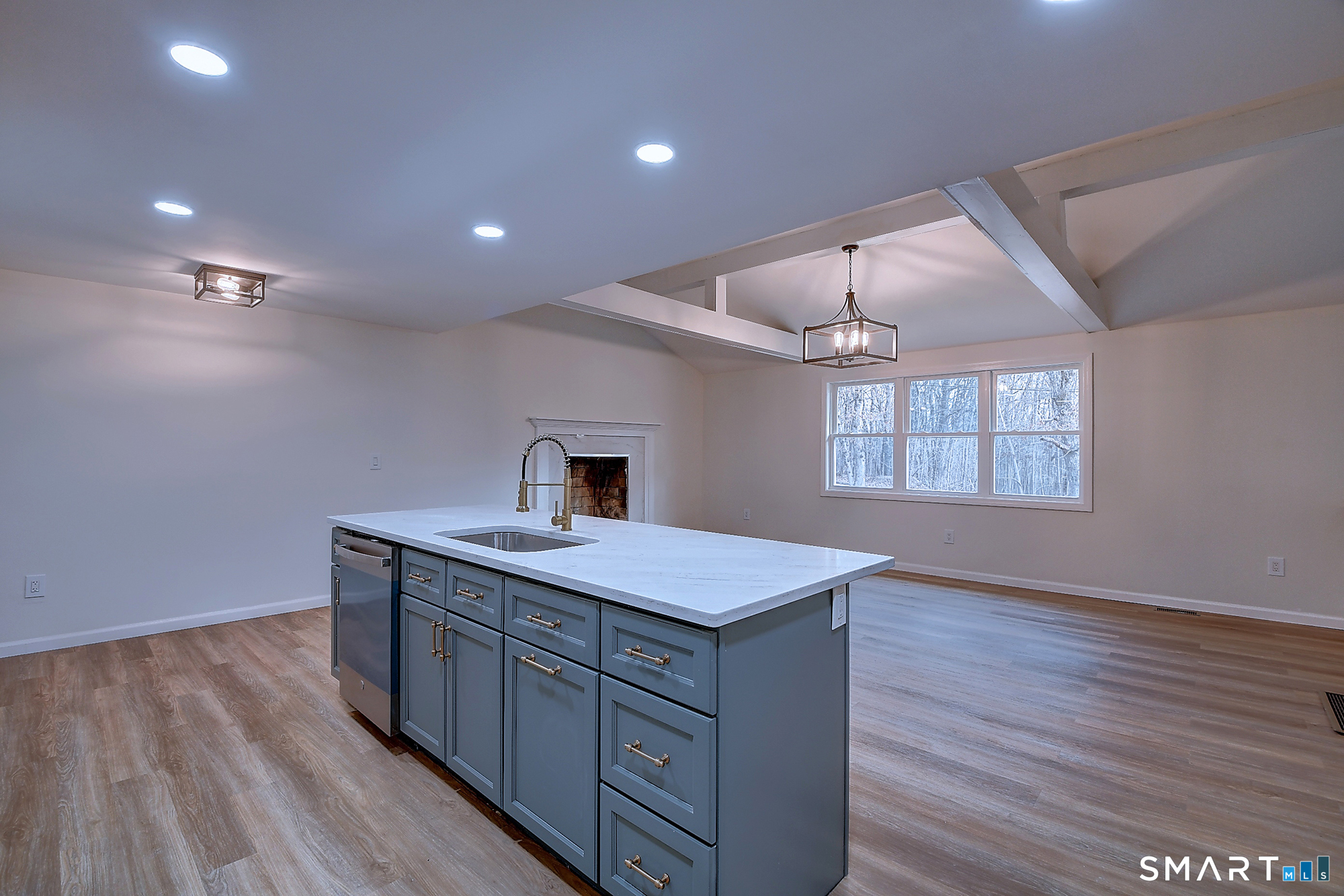 24 Dunay Road Stafford, CT 06076 - Photo 15 of 38 a kitchen with a sink chandelier and wooden floor