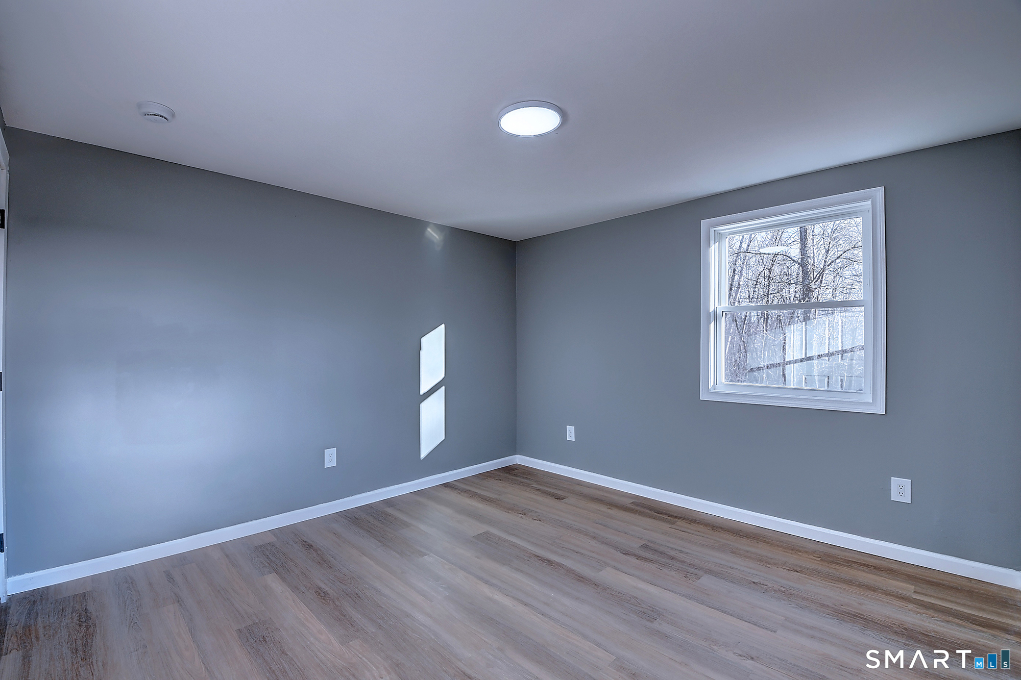 24 Dunay Road Stafford Springs, CT 06076 - Photo 17 of 38 wooden floor in an empty room with a window