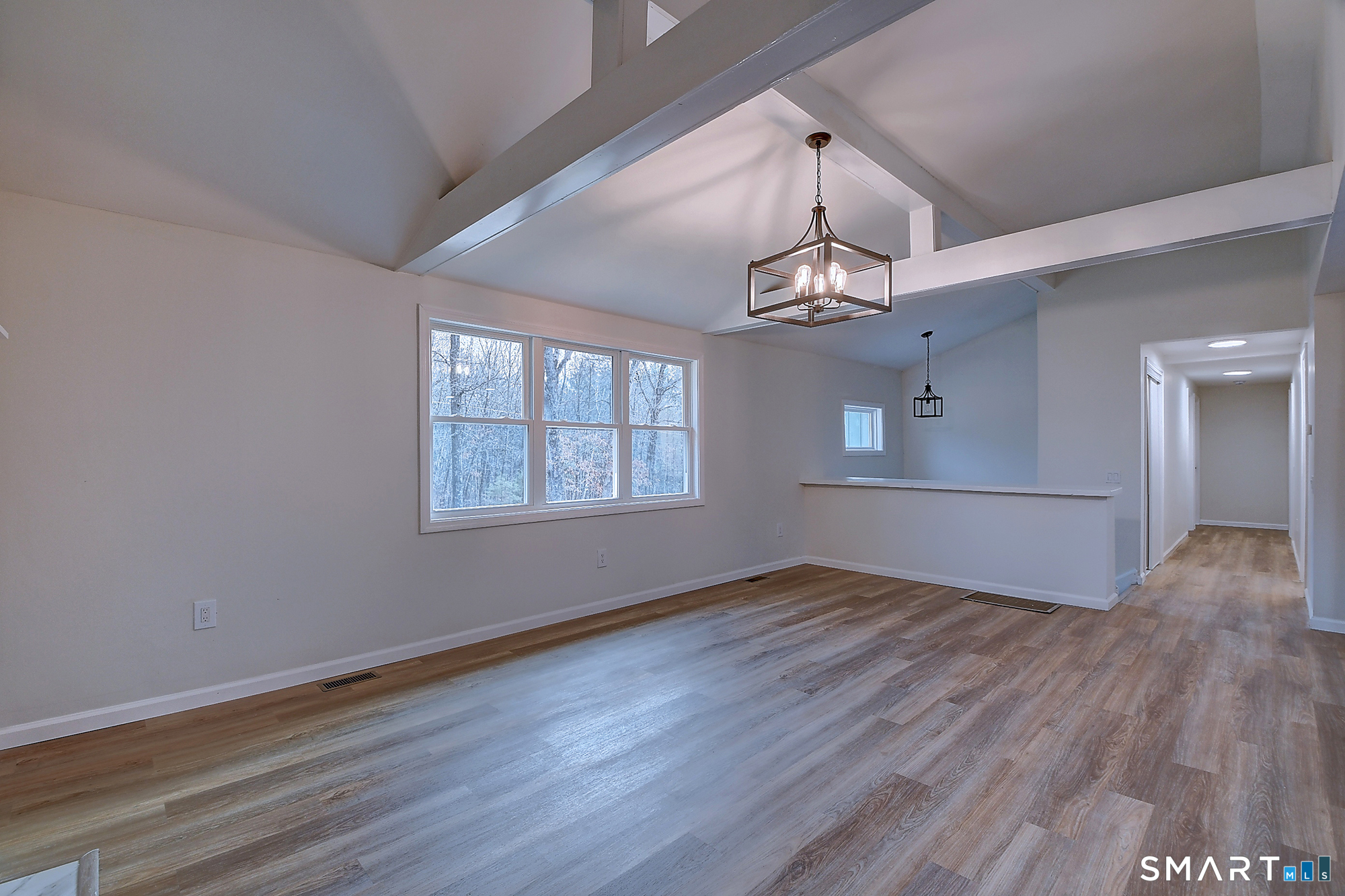 24 Dunay Road Stafford, CT 06076 - Photo 18 of 38 a view of an empty room with wooden floor and a window