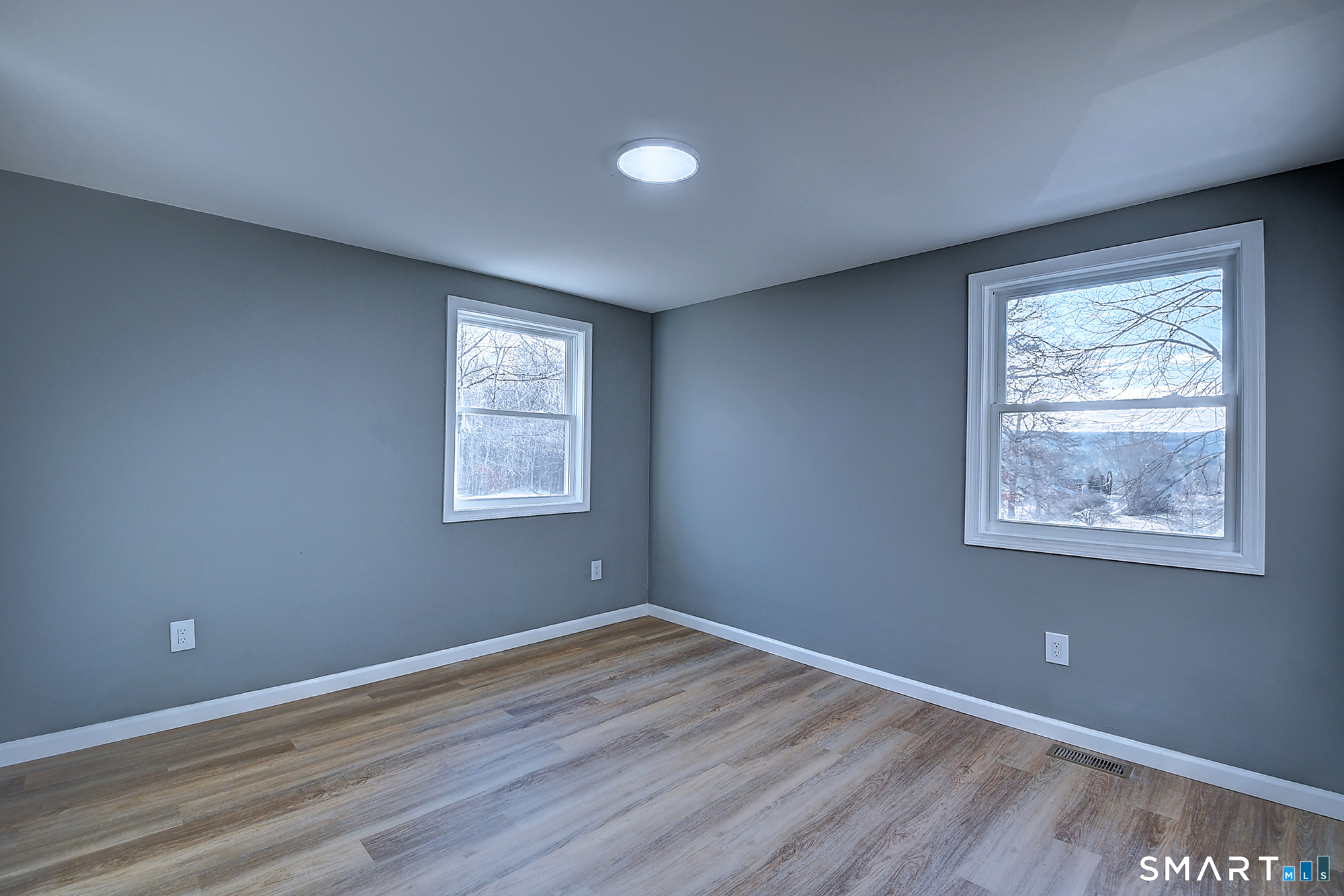 24 Dunay Road Stafford, CT 06076 - Photo 21 of 38 a view of an empty room with wooden floor and a window
