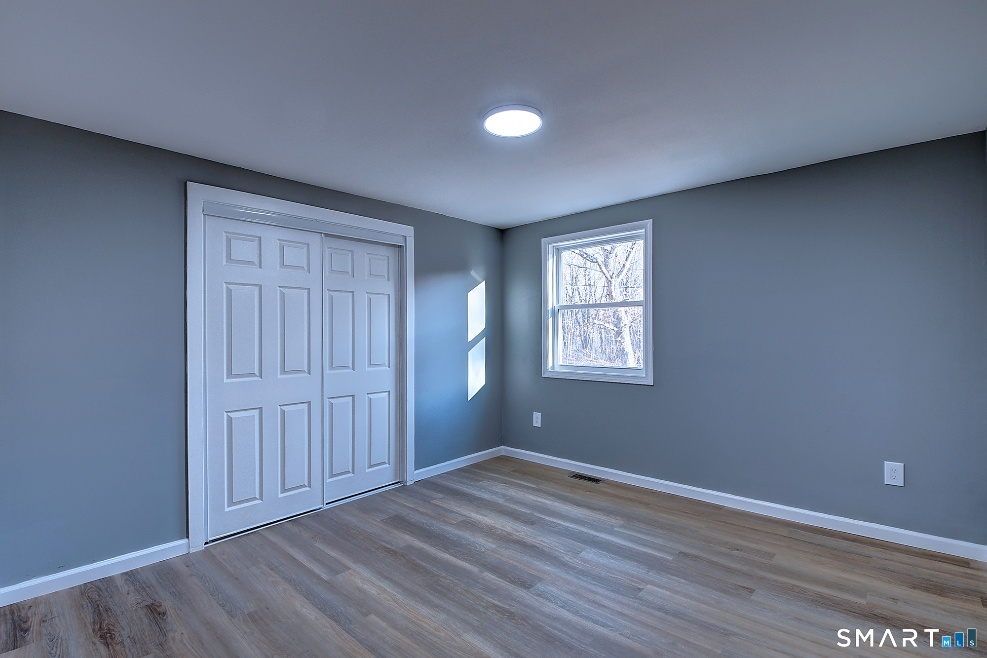 24 Dunay Road Stafford Springs, CT 06076 - Photo 22 of 38 an empty room with wooden floor and windows