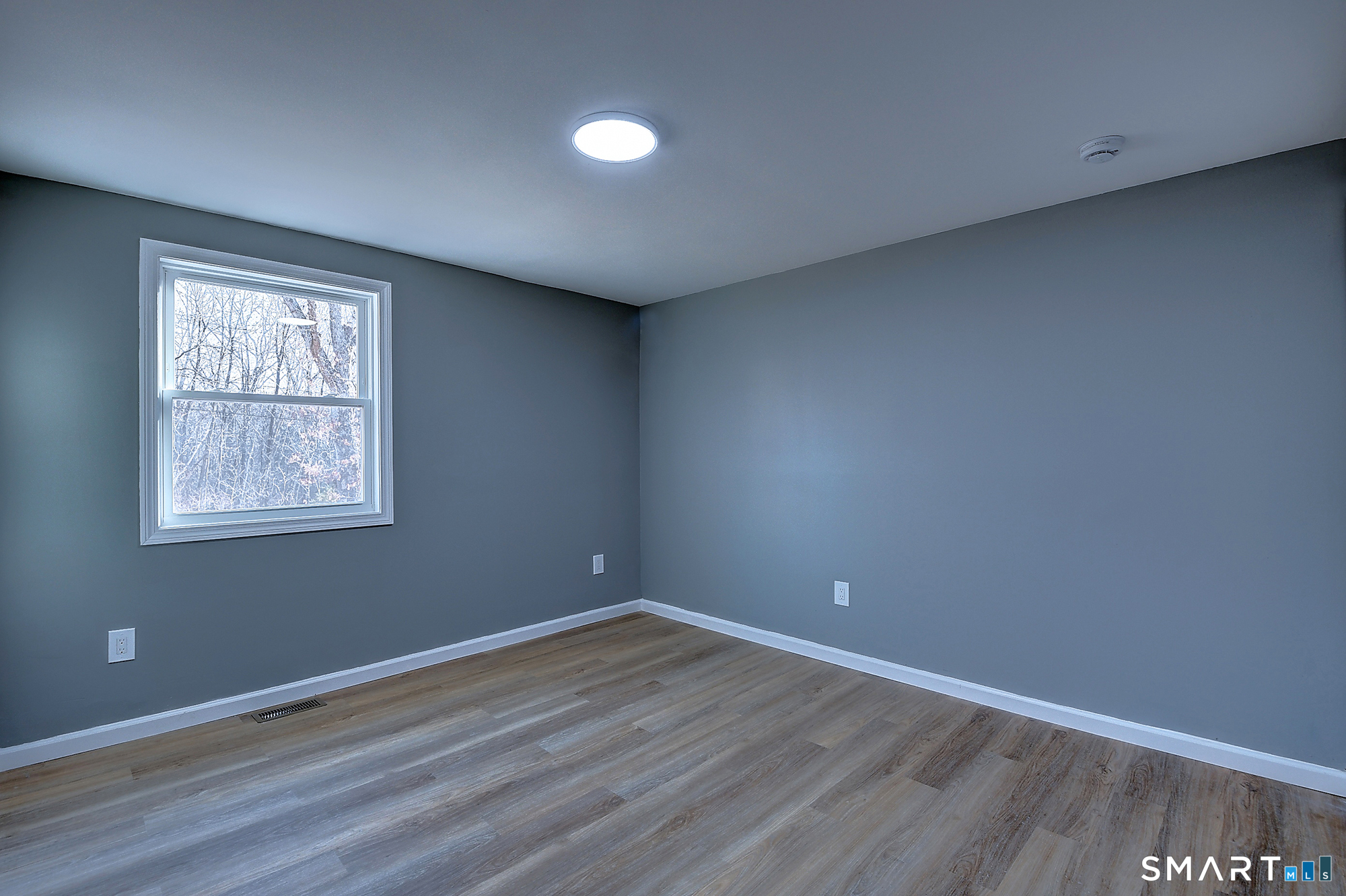 24 Dunay Road Stafford Springs, CT 06076 - Photo 25 of 38 an empty room with wooden floor and windows