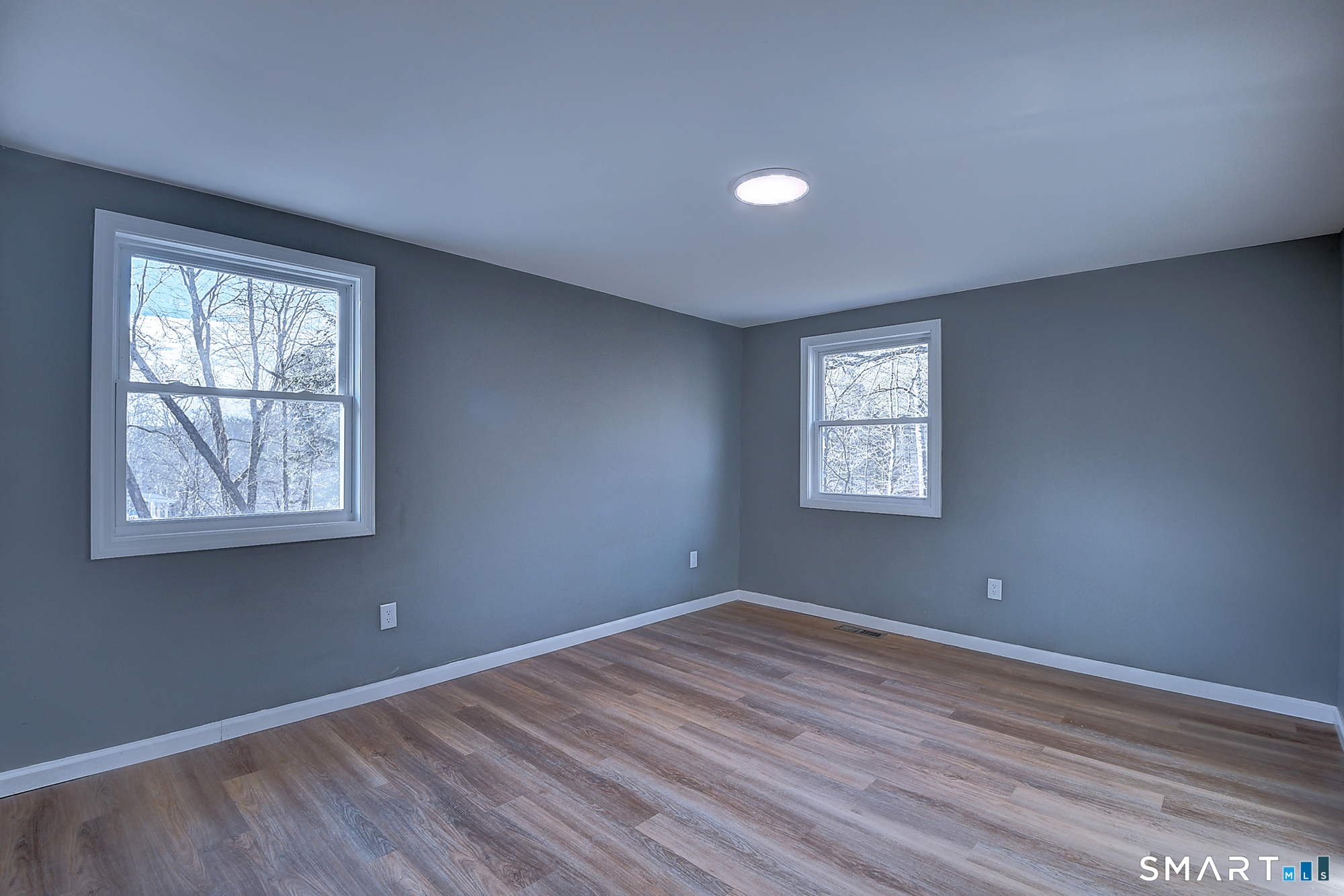 24 Dunay Road Stafford, CT 06076 - Photo 25 of 38 a view of an empty room with wooden floor and a window