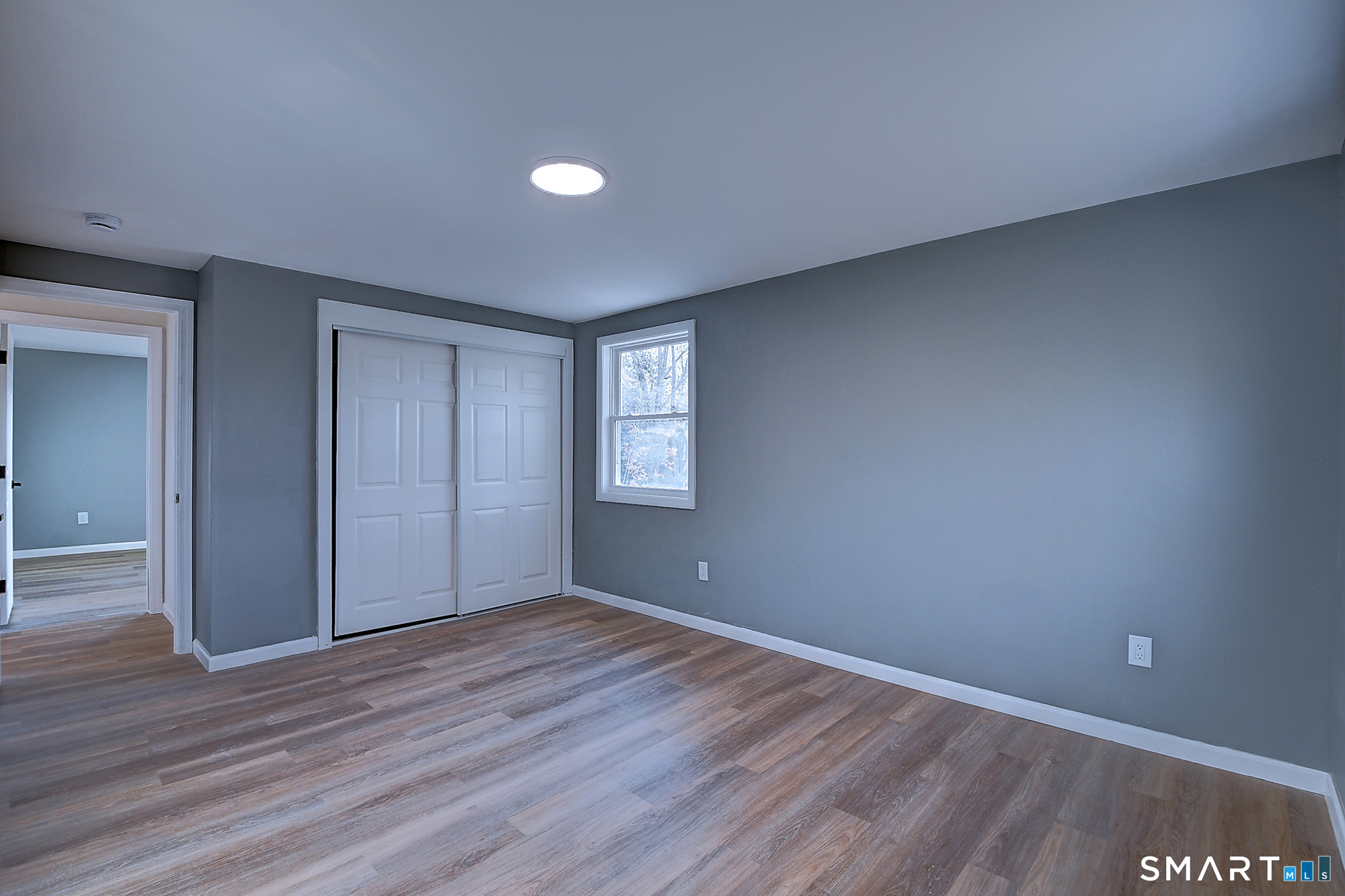 24 Dunay Road Stafford, CT 06076 - Photo 26 of 38 a view of an empty room with wooden floor and closet