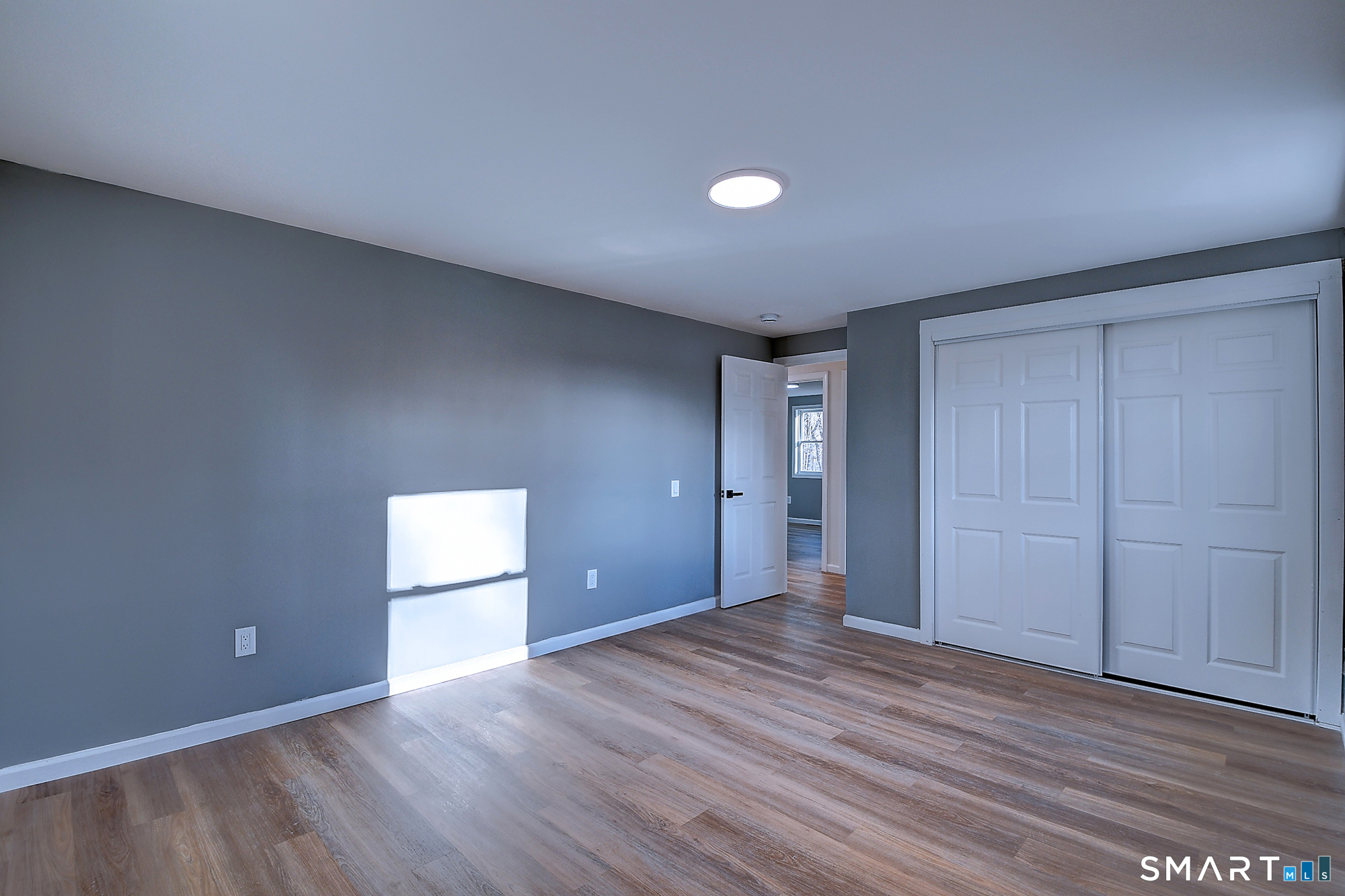 24 Dunay Road Stafford, CT 06076 - Photo 27 of 38 a view of an empty room and wooden floor