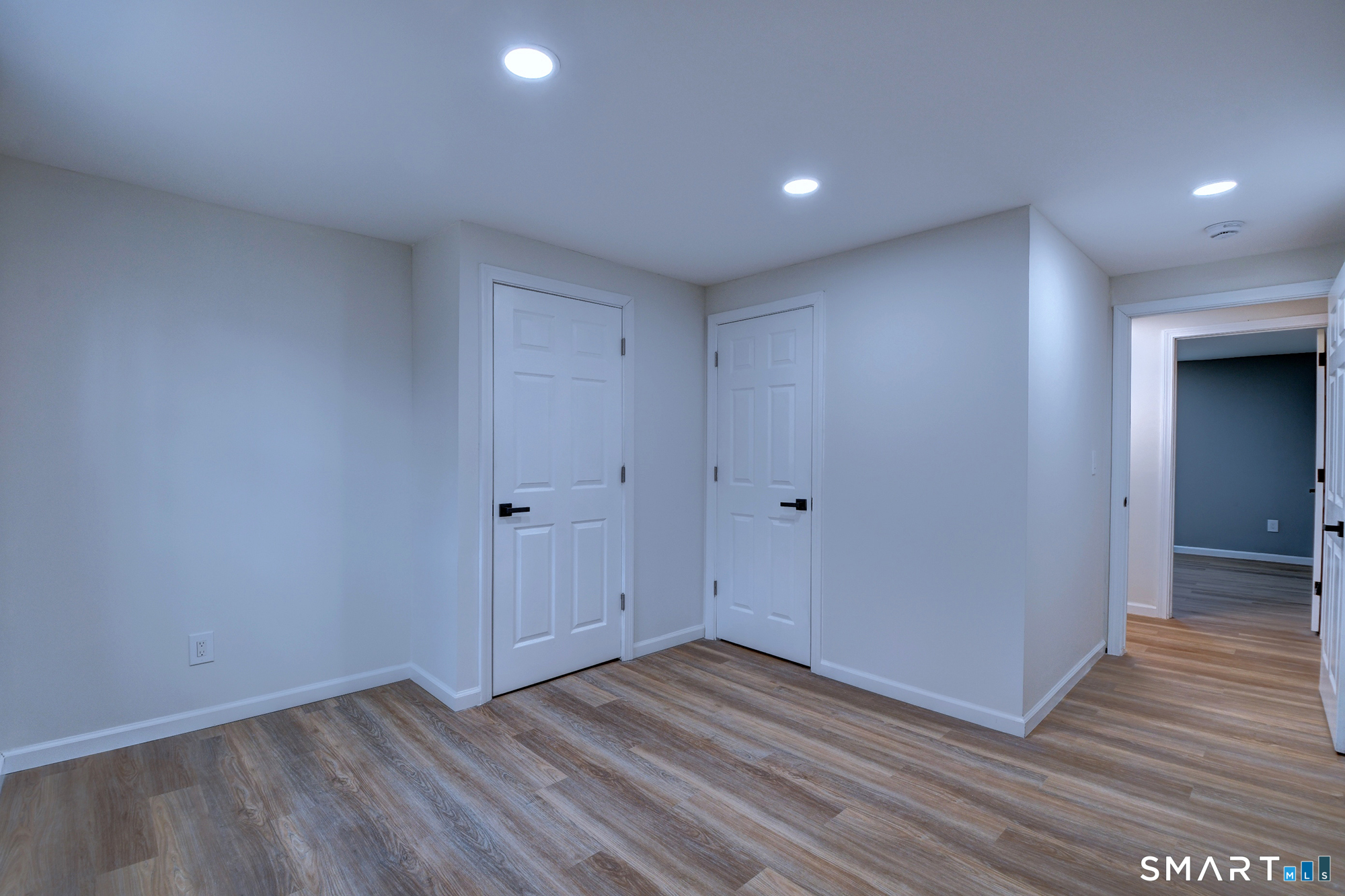 24 Dunay Road Stafford, CT 06076 - Photo 34 of 38 a view of an empty room with wooden floor