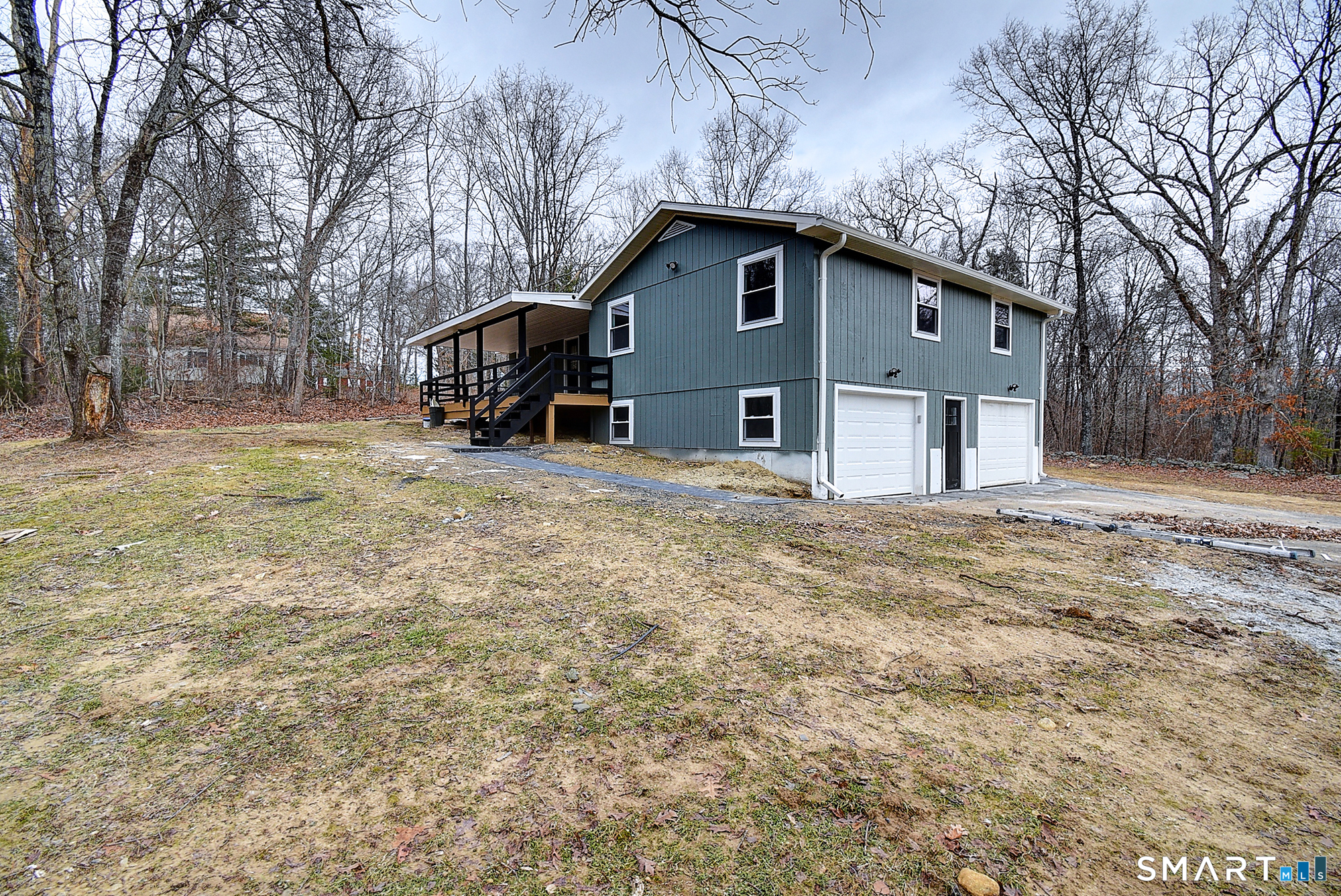 24 Dunay Road Stafford Springs, CT 06076 - Photo 35 of 38 a front view of house with yard and trees in the background