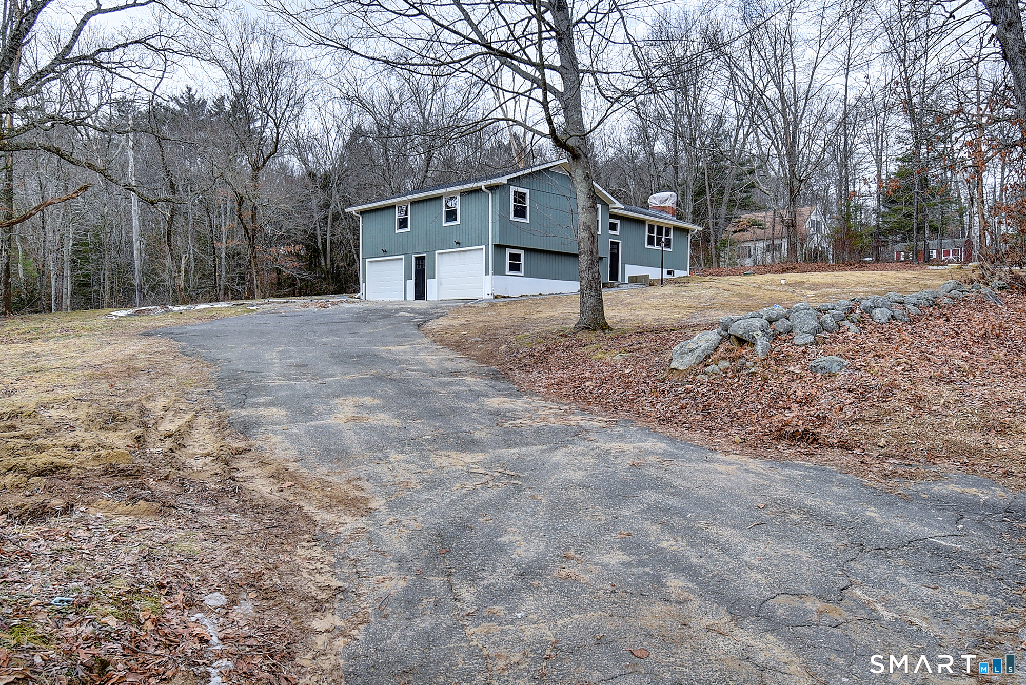 24 Dunay Road Stafford, CT 06076 - Photo 4 of 38 a house that has a tree in front of it