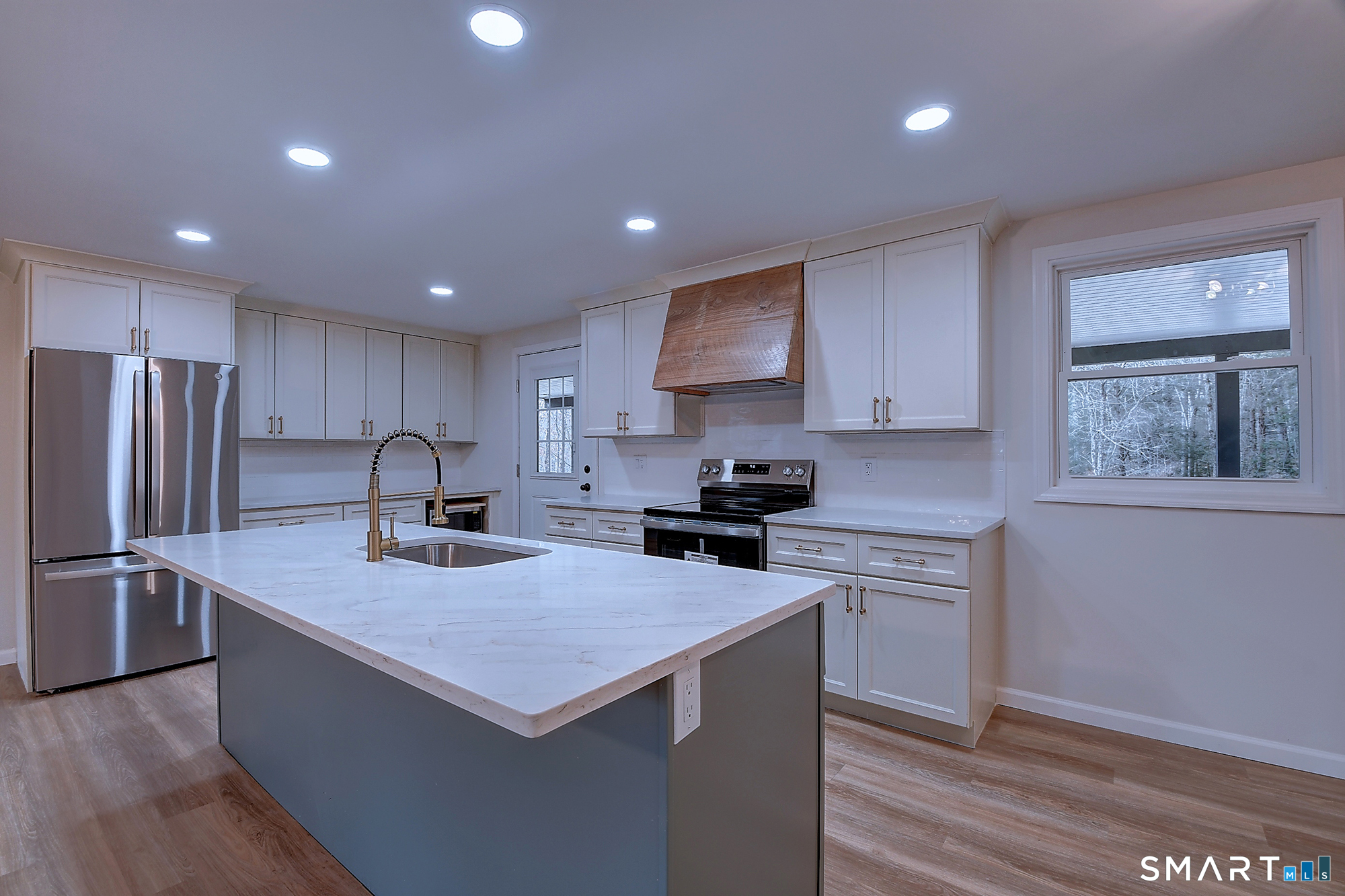 24 Dunay Road Stafford Springs, CT 06076 - Photo 7 of 38 a kitchen that has a lot of cabinets and wooden floor